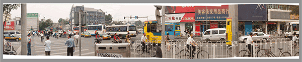 This image was stitched from different exposure taken from a moving car (in case you were wondering why the bus was truncated and two of the the bicyclist appear multiple times. 